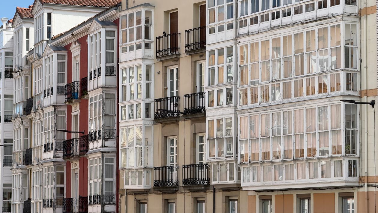 Modern Spanish apartment building with glass balconies